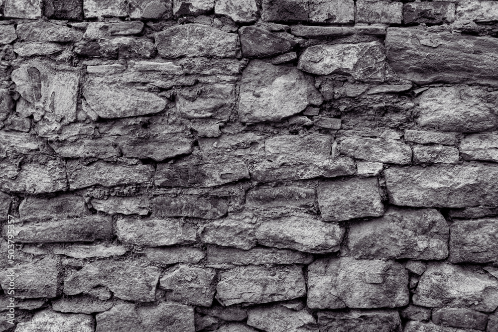 Fototapeta premium Old stone wall with peeling off plaste