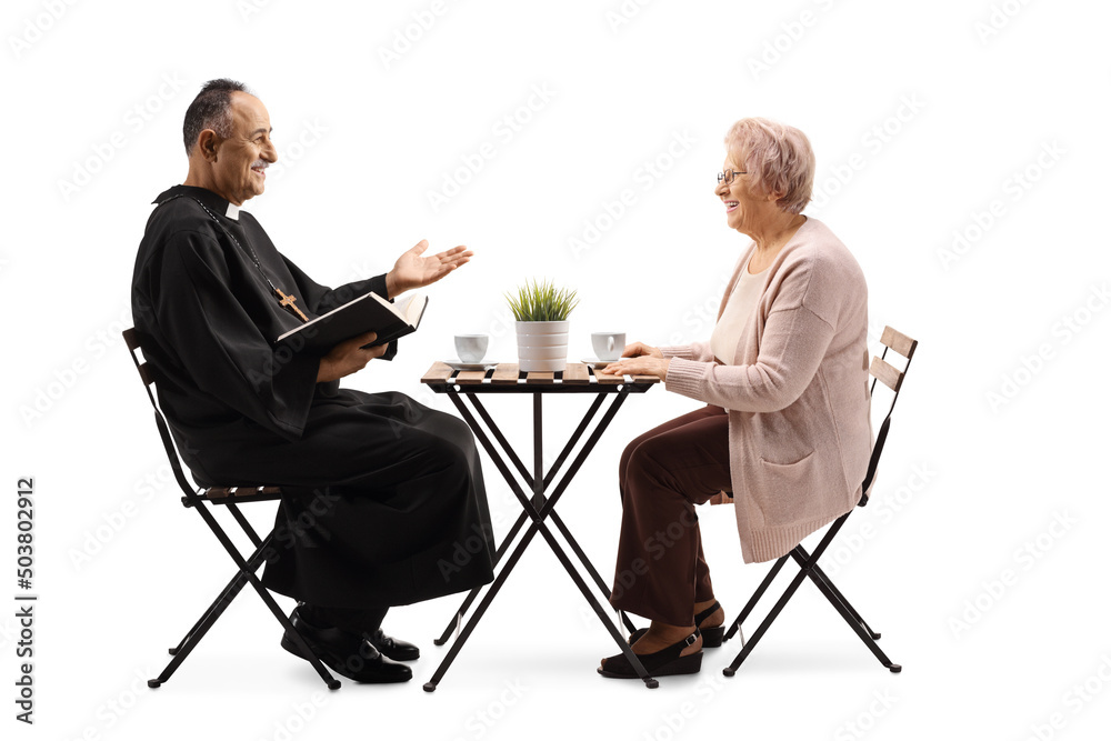 Priest in a cafe sitting and talking to an elderly woman Priest in a cafe sitting and talking to an elderly woman