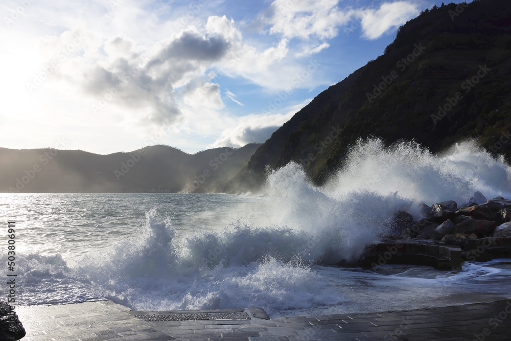 Rocks and waves on the sea near Cinque Terre - Manarola, picturesque fishermen villages in the province of La Spezia, Liguria, Italy