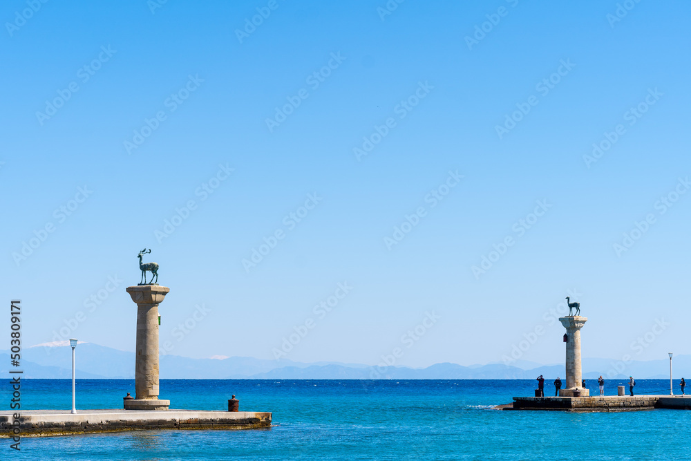 Doe statues in Rhodes harbor at Mandraki in Rhodes Greece