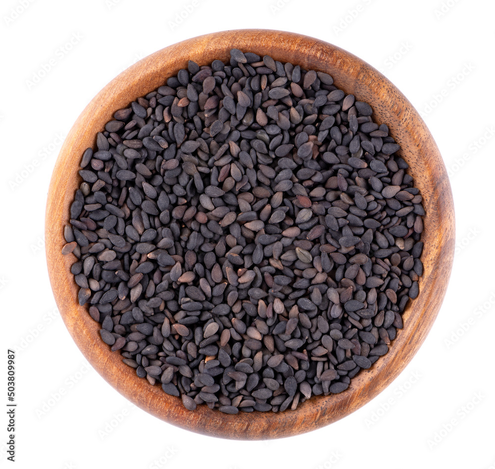 Fototapeta premium Black sesame seeds in wooden bowl, isolated on white background. Organic spice. Top view.
