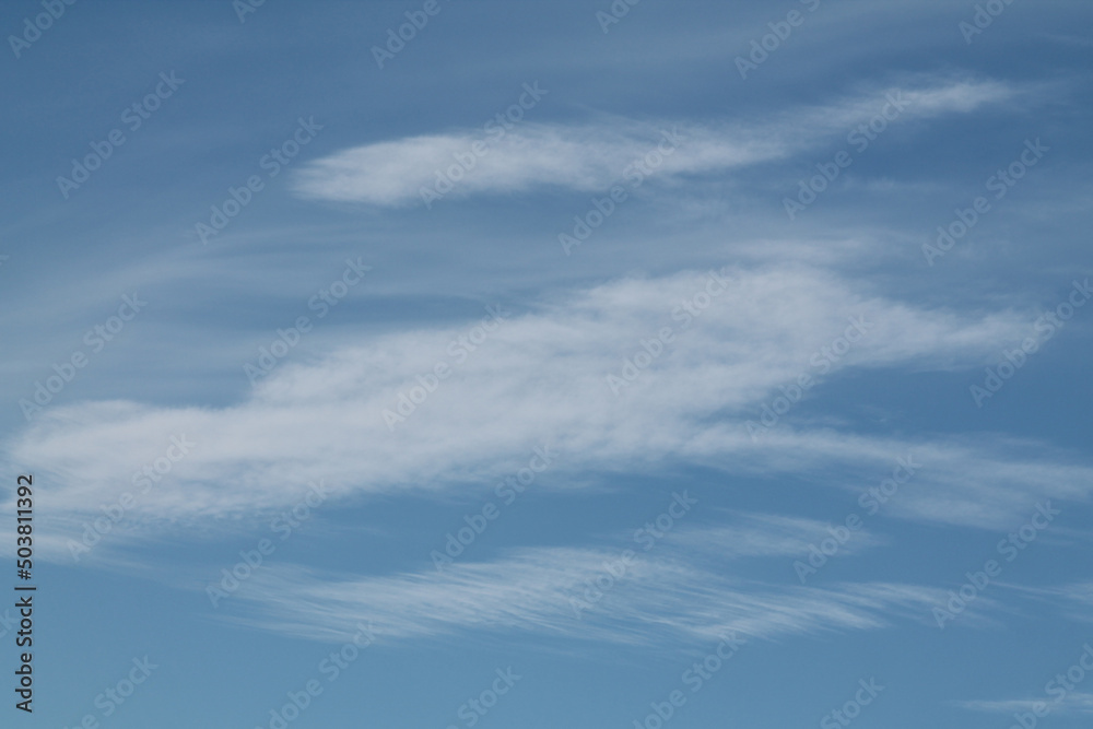 Cirrocumulus lenticularis clouds. Blue sky with white clouds