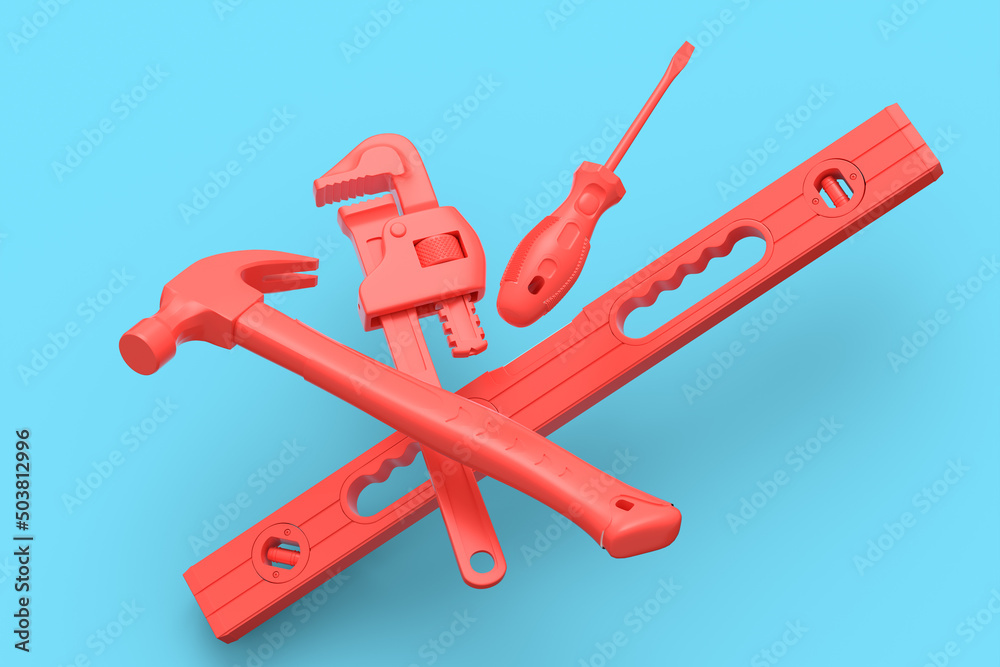Flying view of red construction tools for repair on blue background Flying view of red construction tools for repair on blue background