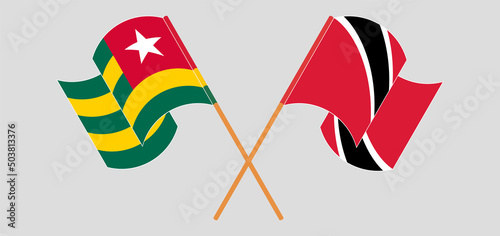 Crossed and waving flags of Togo and Trinidad and Tobago