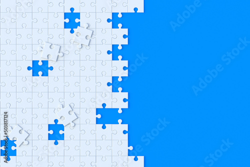 Unfinished white jigsaw puzzle pieces on blue background. Copy space. Top view. 3d render