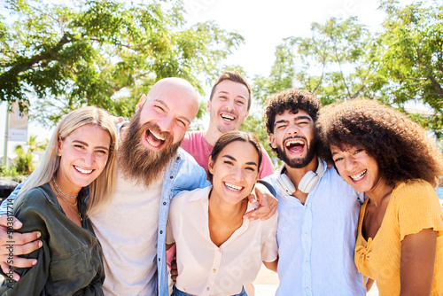 Cheerful Group of friends posing for a photo and having fun. Friendship and community concept