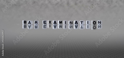 bar examination word or concept represented by black and white letter cubes on a grey horizon background stretching to infinity