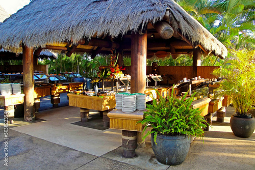 Cuadro en lienzo Alcove with a thatch roof with dining preparations for a luau on Maui, Hawaii