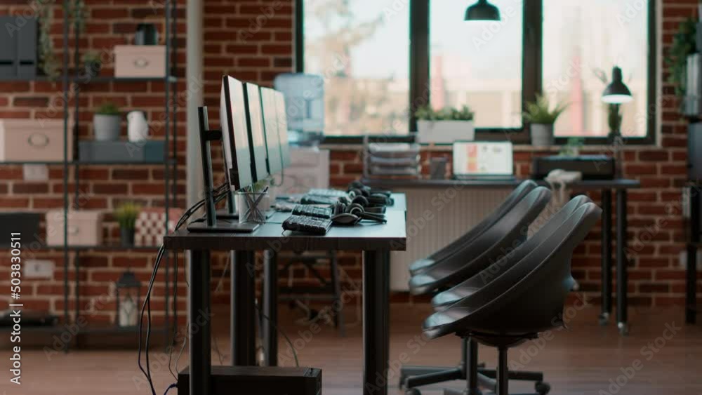 Nobody in office used for call center telecommunication, giving support to helpline clients with headsets and monitors. No people at customer service workstation with modern devices. Nobody in office used for call center telecommunication, giving support to helpline clients with headsets and monitors. No people at customer service workstation with modern devices.