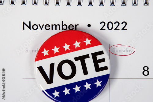 Flag vote pin on November 2022 calendar date for mid-term election event photo
