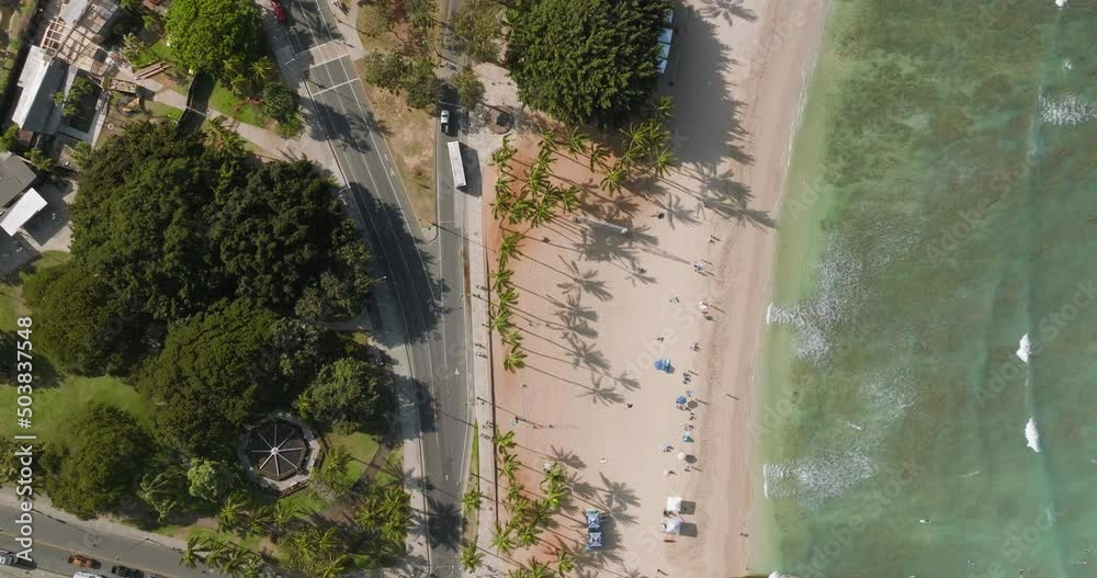 Aerial top down view of Waikiki Beach and people relaxing, swimming and surfing in turquois water in Honolulu, Hawaii Aerial top down view of Waikiki Beach and people relaxing, swimming and surfing in turquois water in Honolulu, Hawaii