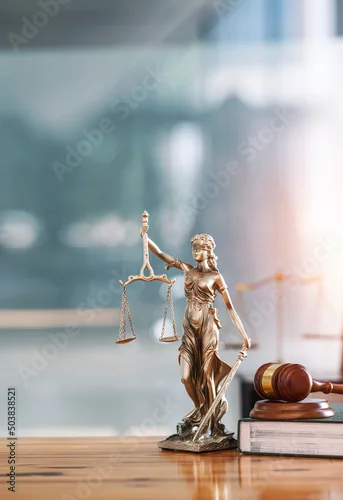 Obraz Legal and law concept. Statue of Lady Justice with scales of justice and wooden judge gavel on wooden table. Panoramic image statue of lady justice.