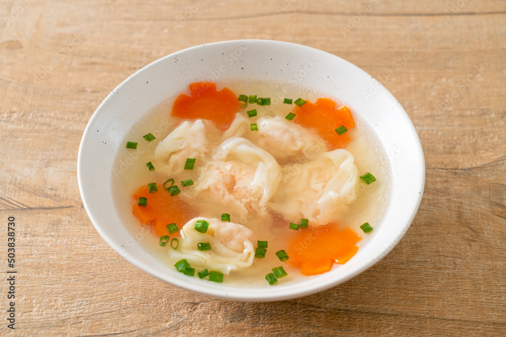 shrimp dumpling soup in white bowl