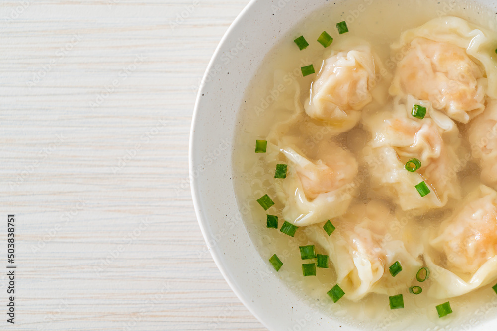 shrimp dumpling soup in white bowl