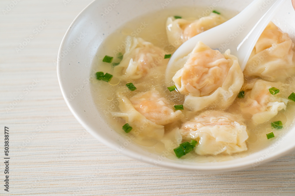 shrimp dumpling soup in white bowl