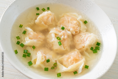 shrimp dumpling soup in white bowl