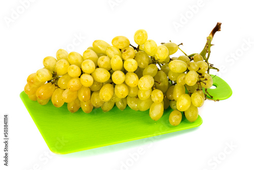 Ripe large bunch of grapes of sultana on white background photo