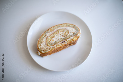 Vanilla White Cake Roll with Cream on a plate
