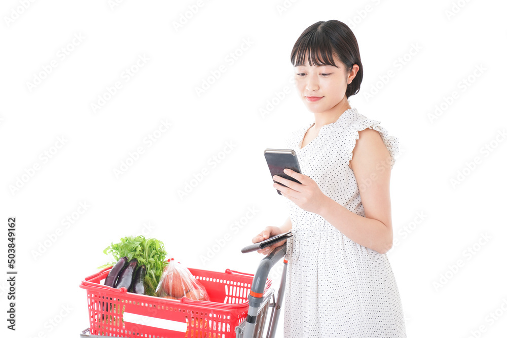 Young woman searching origin of foods at supermarket Young woman searching origin of foods at supermarket