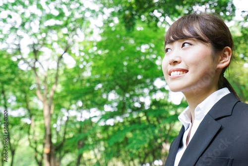 Young business woman smiling with suit