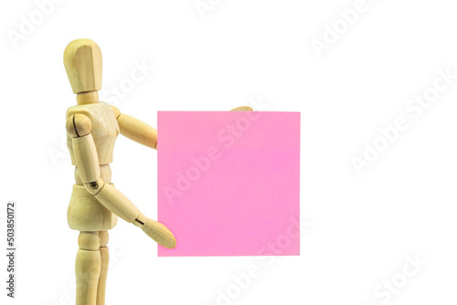 Wooden human dummy manikin with moveable limbs pose holding paper on a white background