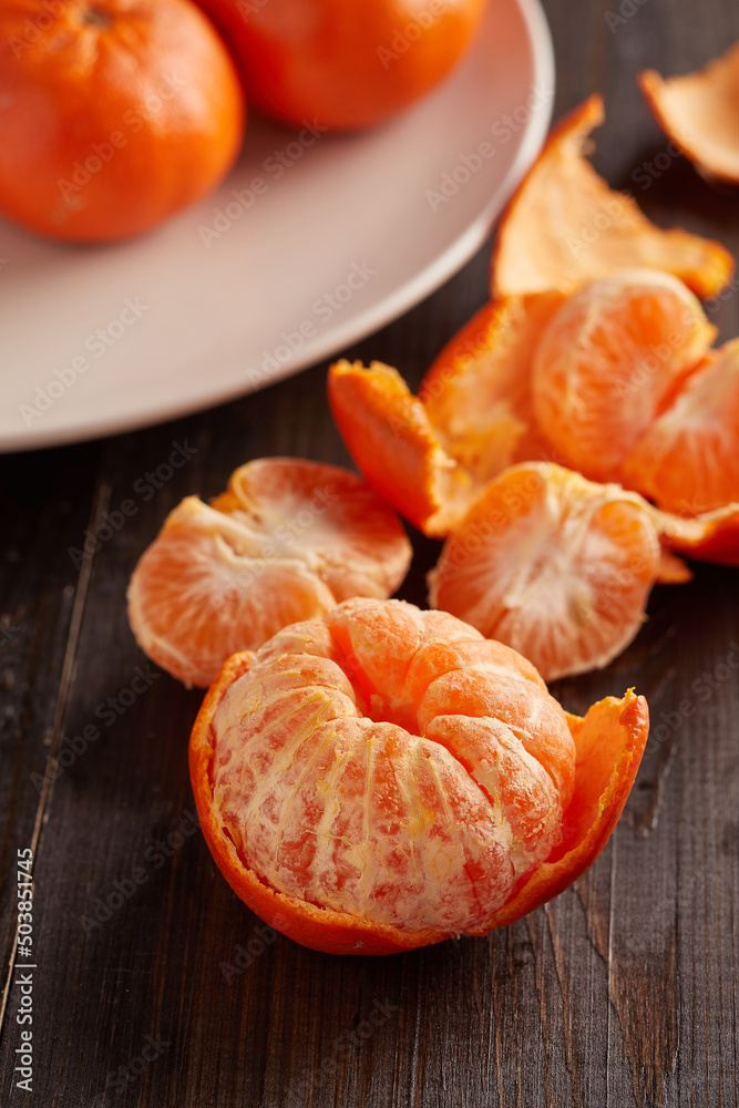 tangerines in white plate on wooden background tangerines in white plate on wooden background