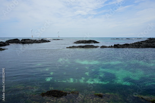 turbines on the sea and clear water