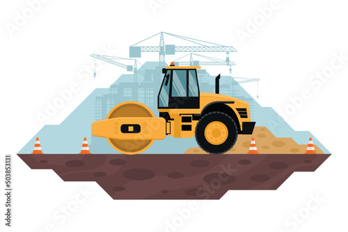Soil compactor realizando trabajos de nivelacion y compactacion de terreno, maquinaria pesada utilizada en la industria de la contruccion y mineria. Conos de seguridad photo