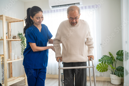 Billede på lærred Asian senior elderly man patient doing physical therapy with caregiver