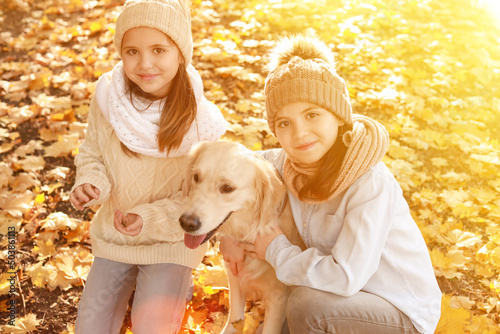 Little girls with cute dog ...