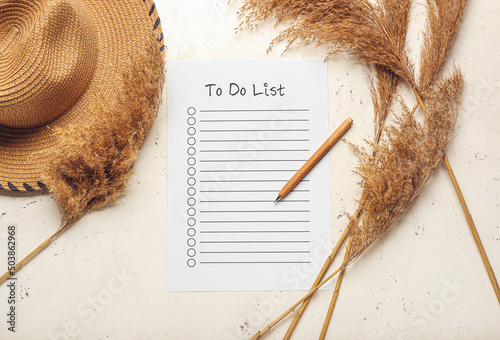 Blank to do list, pen, hat ...