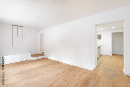 Interior photo of renovated apartment without furniture with white walls