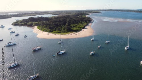 Aerial drone shot of nature sand flat banks island in Hastings River inlet with yachts and sail boats Pacific Ocean Port Macquarie NSW Mid North Coast Australia 4K photo