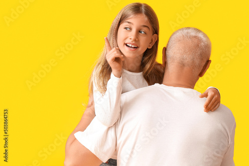 Little girl with her grandf...