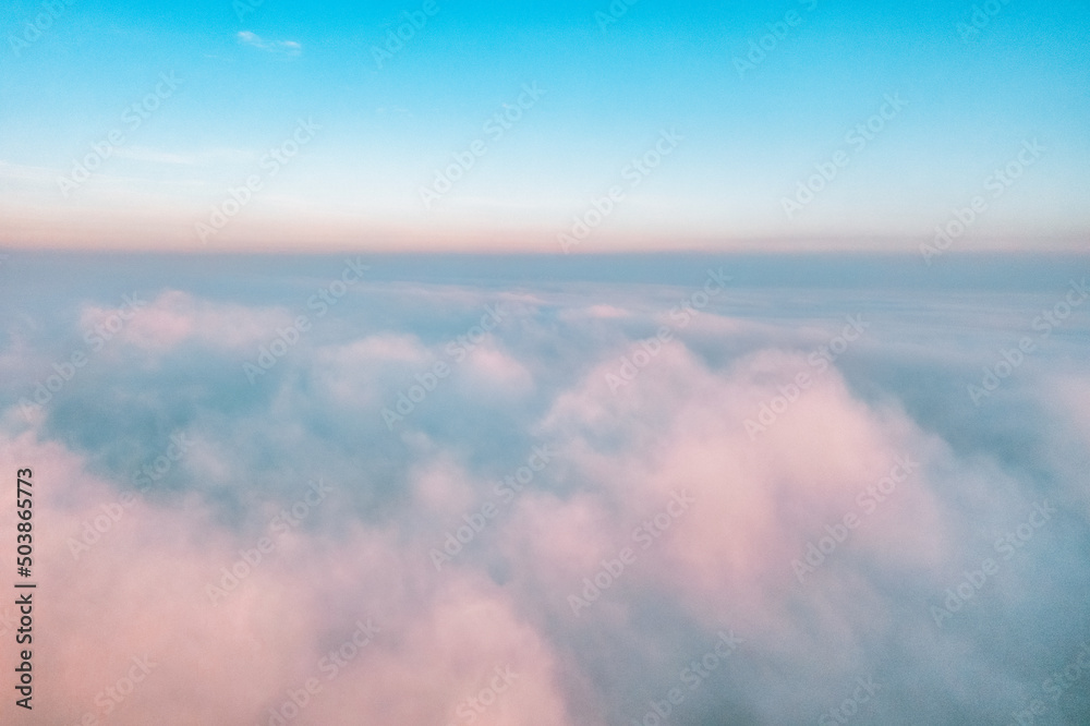 Sky above the clouds, aerial view of thick fog and clouds lying above the ground, beautiful landscape and background