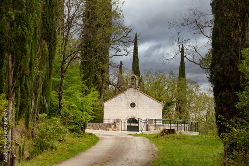Old Latin church in valley on a spring day