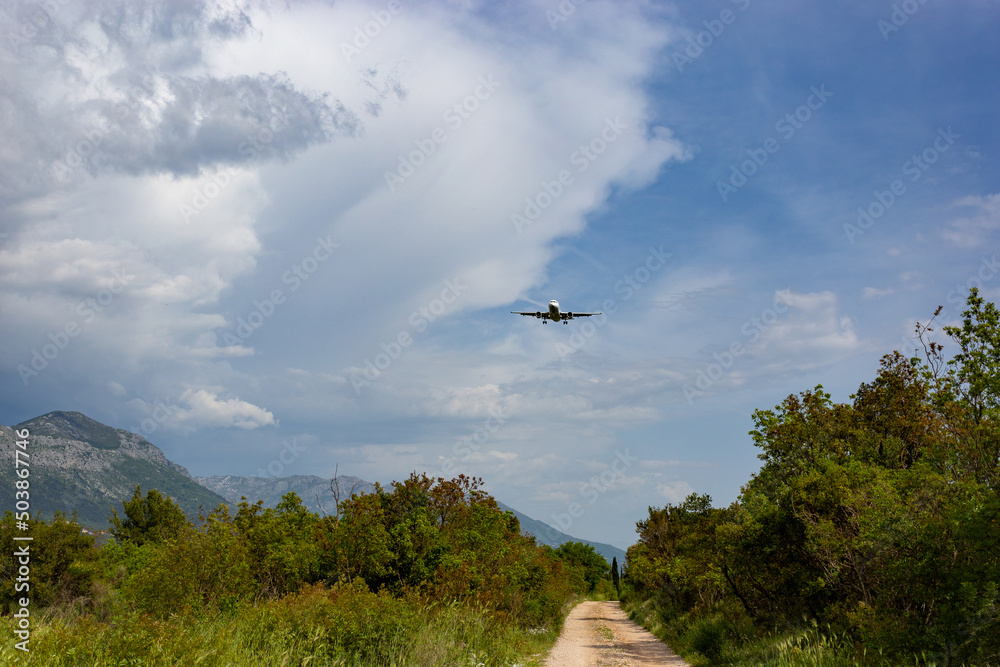 Modern passenger plane coming in for landing Modern passenger plane coming in for landing