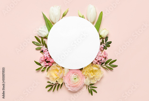 Composition with blank card and beautiful flowers on pink background