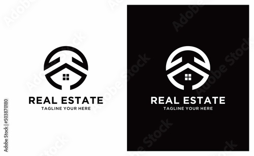 Real Estate Logo. Black Circle Shape with Negative Space House Symbol isolated on Luxury Background. Usable for Construction Architecture Building Logo Design Template Element.
