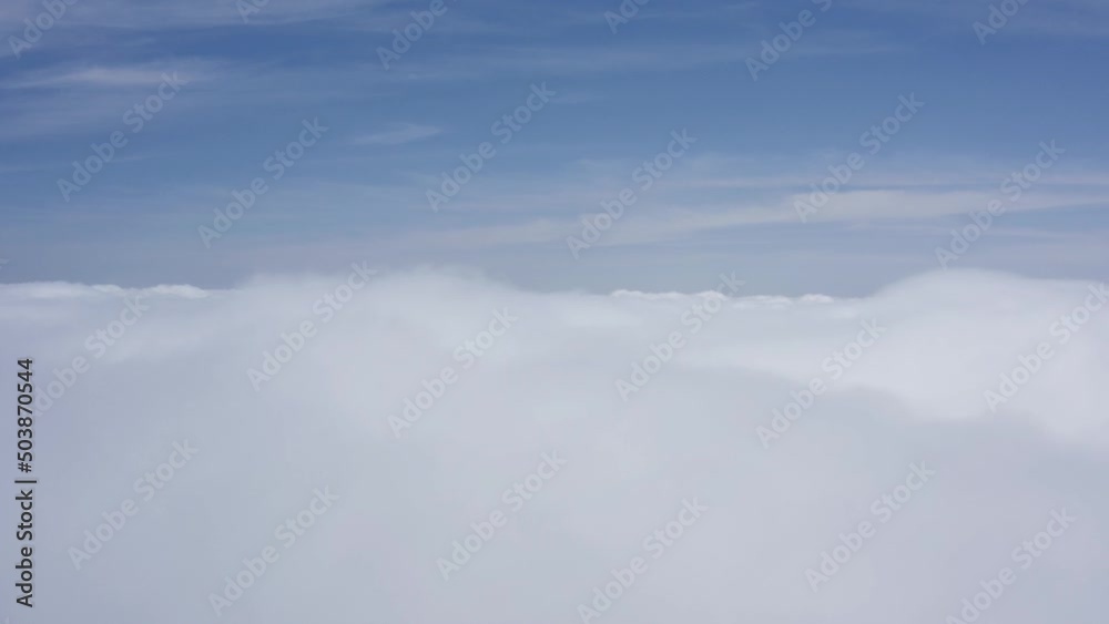 A stunning drone shot, a drone ascends through clouds at a high altitude, California A stunning drone shot, a drone ascends through clouds at a high altitude, California