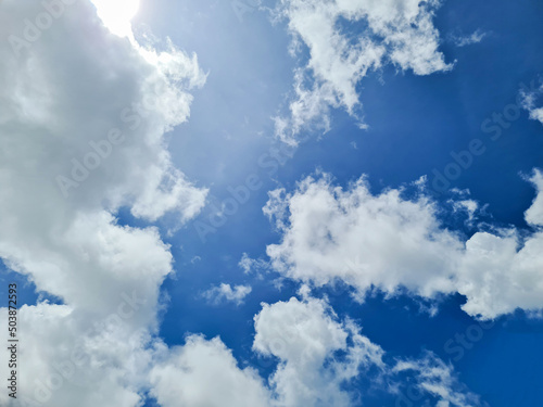 White clouds in the blue sky. Cloud background in summer blue sky.
