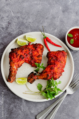 Tandoori Chicken with Condiments Top Down Vertical Photo