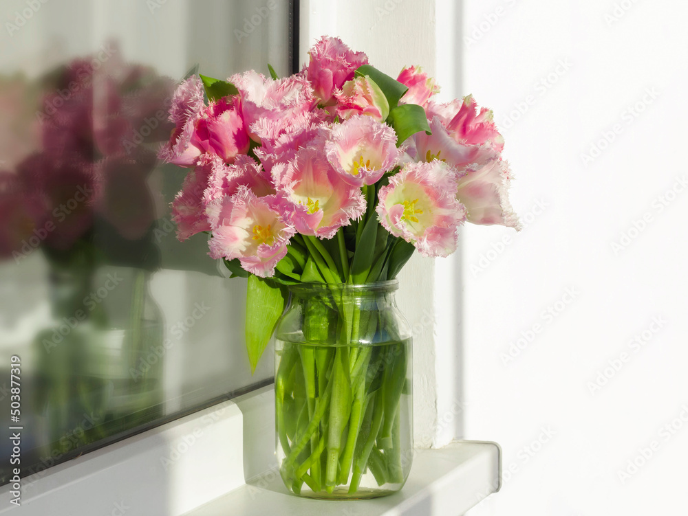 a beautiful bouquet of soft pink terry tulips by the window a beautiful bouquet of soft pink terry tulips by the window