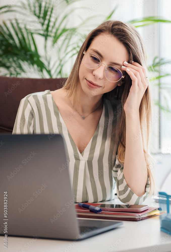 Young woman working on a computer Young woman working on a computer