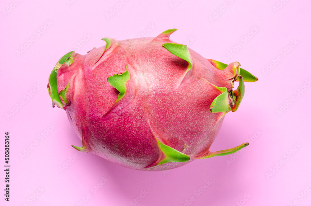 Fototapeta premium Halves of Fresh organic Dragon Fruit on a blue background.