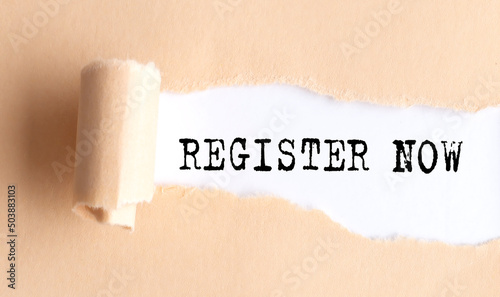 The text REGISTER NOW appears on torn paper on white background.
