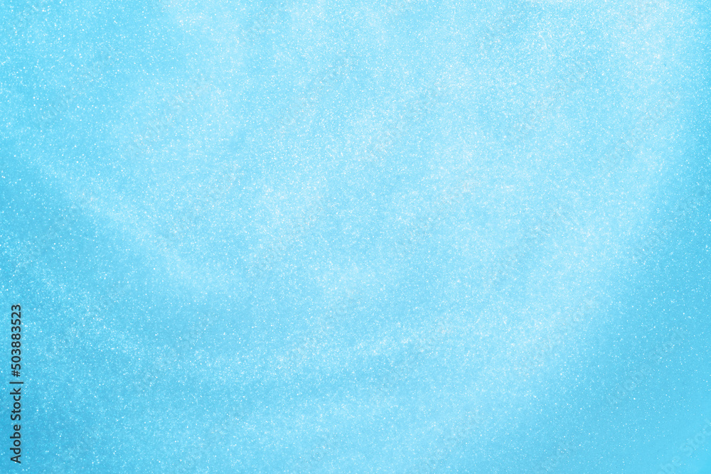 Naklejka premium Blue sparkling background. glitter background.