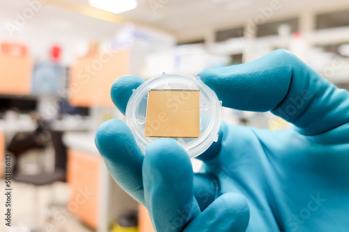 An SPR (surface plasmon resonance) chip made of gold. SPR is a laboratory technique used for construction of lab-on-a-chip sensors and analysis of interactions between molecules. photo