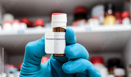 A glass vial of donepezil - a medication used to treat dementia of the Alzheimer's type. photo