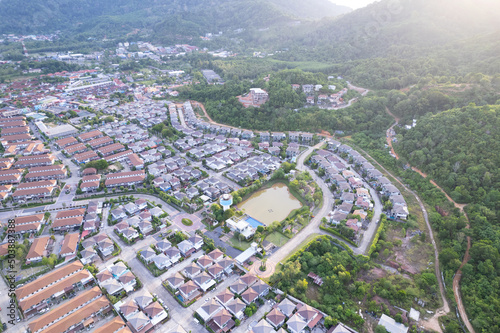 New development real estate. Aerial view of residential houses and driveways neighborhood during a fall sunset or sunrise time. Tightly packed homes. Top view over private houses in phuket thailand
